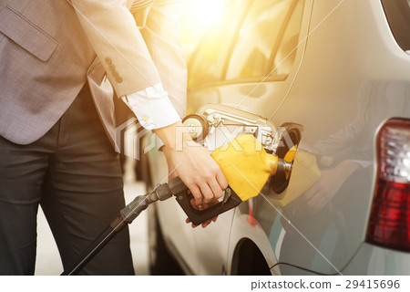 Man pumping petrol Man pumping petrol 29415696