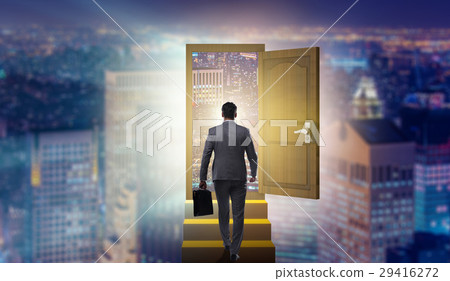 Businessman walking towards open door Businessman walking towards open door 29416272