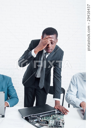 Business bankruptcy. Sad manager and broken laptop Business bankruptcy. Sad manager and broken laptop 29416437