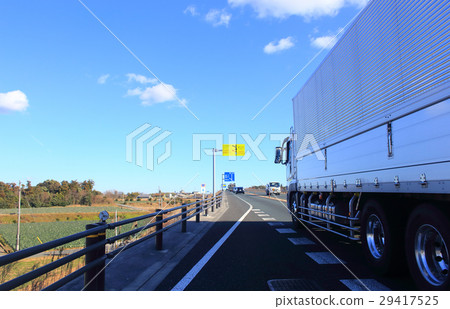 Large cargo truck running on the national highway 29417525
