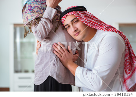 Young arab muslim family with pregnant wife 29418154