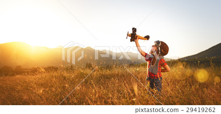 Child pilot aviator with airplane dreams of traveling in summer 29419262