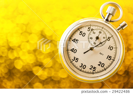 Stopwatch on yellow background Stopwatch on yellow background 29422486