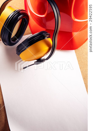 Helmet, earphones and blank sheet of paper Helmet, earphones and blank sheet of paper 29422595