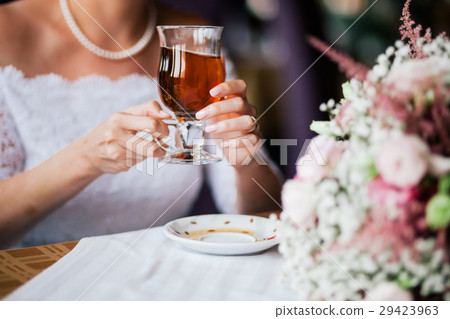 bride holding the cup of tea bride holding the cup of tea 29423963