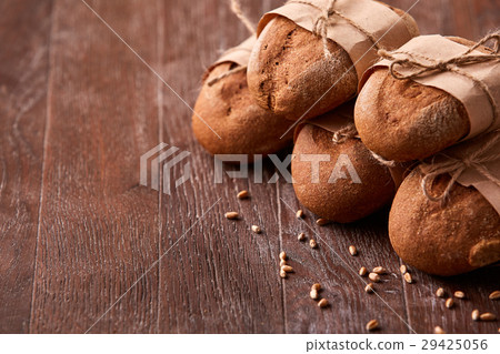 different bread on the wooden table, wheat, paper 29425056