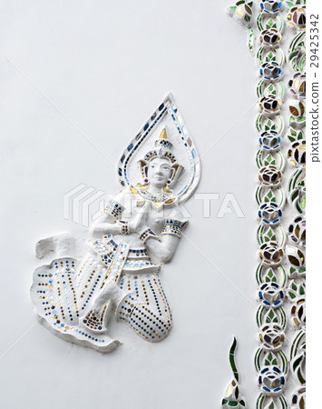 Angel stucco in the traditional Thai style. 29425342
