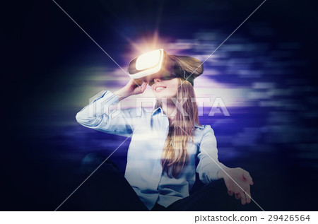 Woman wears virtual reality glasses 29426564