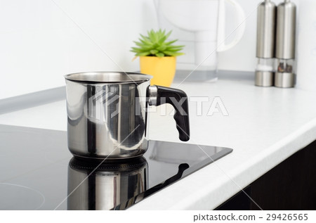 Mug in modern kitchen with induction stove Mug in modern kitchen with induction stove 29426565