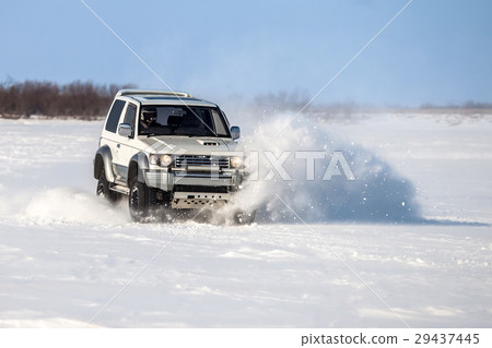 Classic SUV riding in the snow Classic SUV riding in the snow 29437445