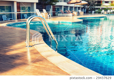 Swimming pool and staircase in the resort. Swimming pool and staircase in the resort. 29437629