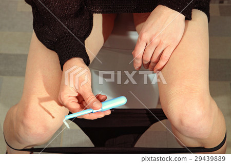 tampon in hand of woman tampon in hand of woman 29439889