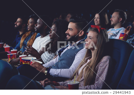 Company of international people watching  movie i 29441943