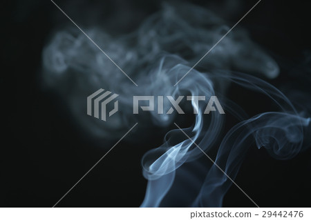 mystery wavy smoke rising over black background 29442476