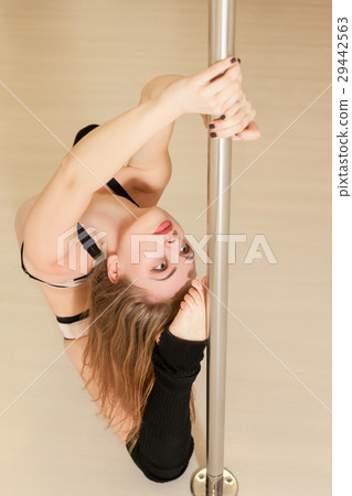 Professional pole dance woman sitting on the floor 29442563