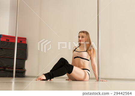 Professional pole dance woman sitting on the floor 29442564