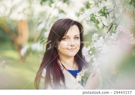 beautiful young brunette woman standing near the beautiful young brunette woman standing near the 29443157