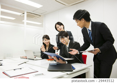 A businessman presenting businessman business team A businessman presenting businessman business team 29443512