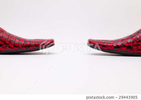 Detail of men's red shoes on white table Detail of men's red shoes on white table 29443905