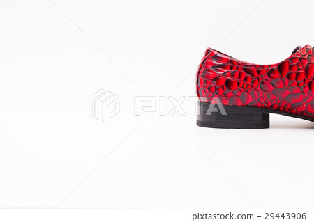 Detail of men's red shoes on white table Detail of men's red shoes on white table 29443906