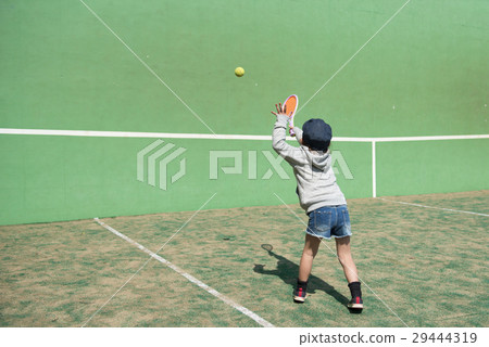 A girl playing tennis 29444319