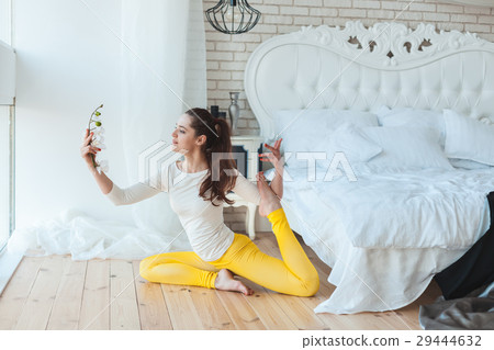 Girl is doing gymnastics. 29444632