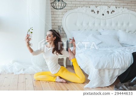 Woman doing exercises and meditates. 29444633