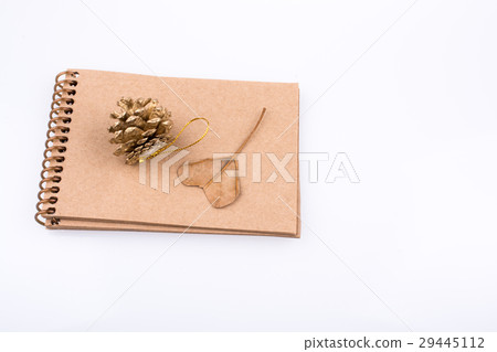 Heart shaped leaf, pine cone and a notebook on Heart shaped leaf, pine cone and a notebook on 29445112