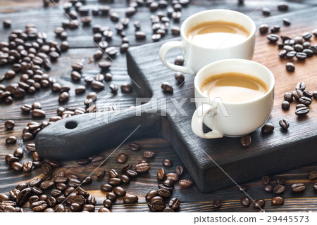 Two cups of coffee with coffee beans 29445573