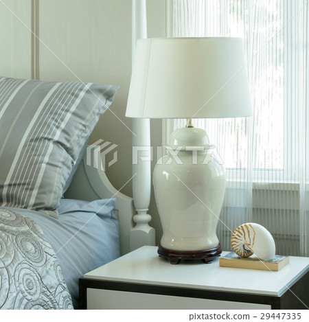 cozy bedroom with pillows and reading lamp cozy bedroom with pillows and reading lamp 29447335
