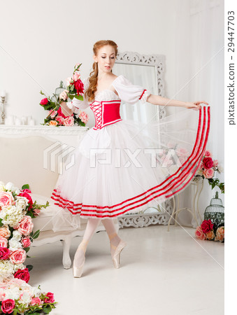 Pretty ballerina holding flowers Pretty ballerina holding flowers 29447703