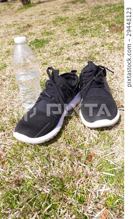 Shoes and PET bottles on the lawn 29448123