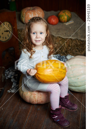 Portrait of adorable smiling girl posing with Portrait of adorable smiling girl posing with 29448189