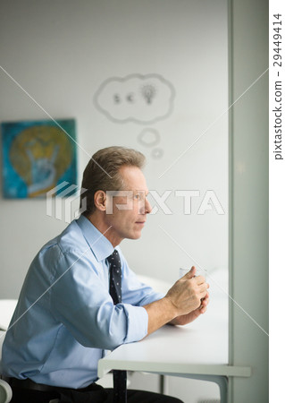 Businessman having coffee break 29449414
