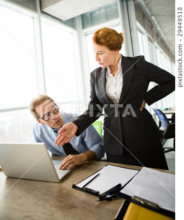 Angry boss screaming at workers Angry boss screaming at workers 29449518