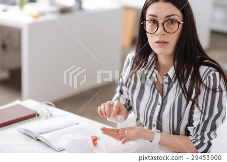 Confused young woman looking straight at camera 29453900