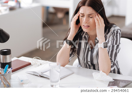 Young woman having terrible headache 29454061