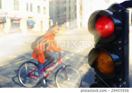 The girl on a bicycle on a city street The girl on a bicycle on a city street 29455936