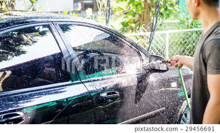 Man washing the black car. Man washing the black car. 29456691