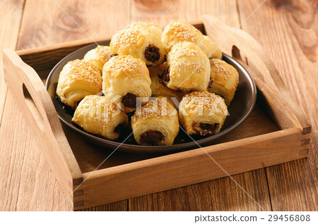 Homemade sausage rolls on wooden background. 29456808