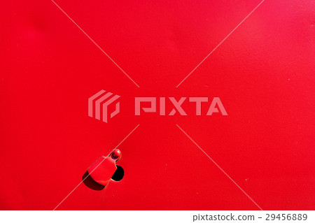 Red colored metal holder with an opening 29456889
