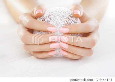 pink manicure with a white ball of yarn pink manicure with a white ball of yarn 29458181