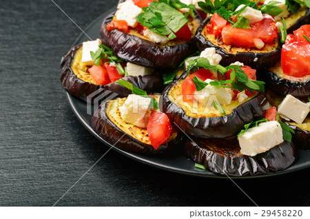 Grilled eggplants with garlic,feta cheese,tomatoes Grilled eggplants with garlic,feta cheese,tomatoes 29458220