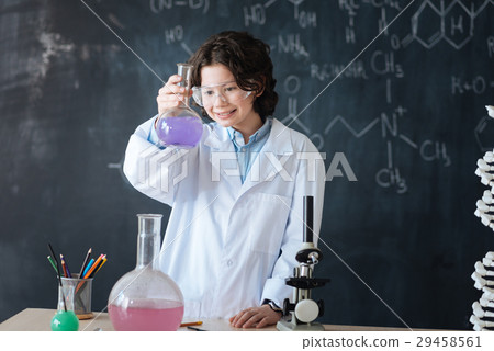 Positive little scientist enjoying chemistry Positive little scientist enjoying chemistry 29458561