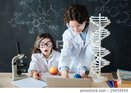 Overwhelmed little children studying microbiology Overwhelmed little children studying microbiology 29458934