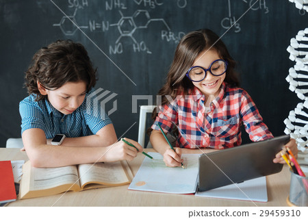 Skilled little pupils studying languages at school