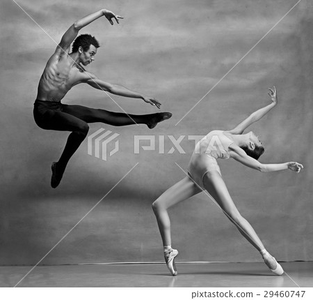 Couple of ballet dancers posing over gray 29460747