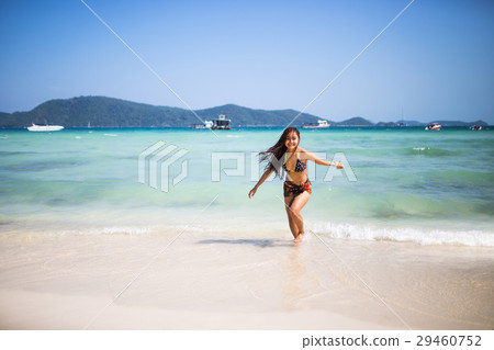 girl enjoying and runing on the beach. 29460752