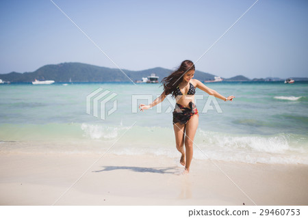 girl enjoying and runing on the beach. 29460753