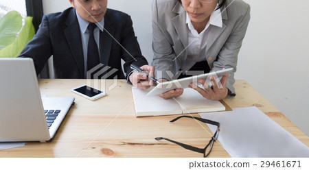 Businessman using a digital tablet to discuss Businessman using a digital tablet to discuss 29461671